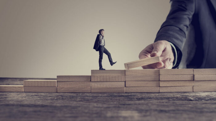 Retro vintage style image of a business person walking up steps