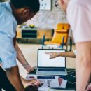 Business person team working with blank screen laptop at office