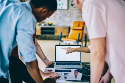 Business person team working with blank screen laptop at office