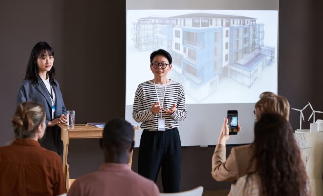 Businesswoman holding presentation for business people