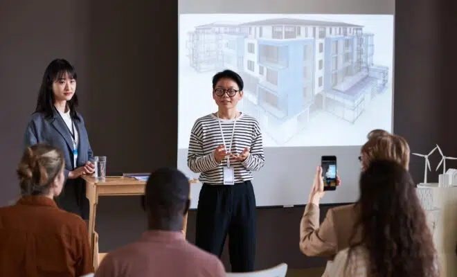 Businesswoman holding presentation for business people