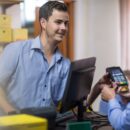 Customer using credit card reader at store