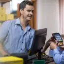 Customer using credit card reader at store