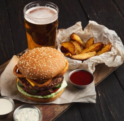 Fast food restaurant dish. Hamburger and fries wedges