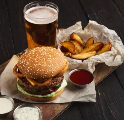 Fast food restaurant dish. Hamburger and fries wedges